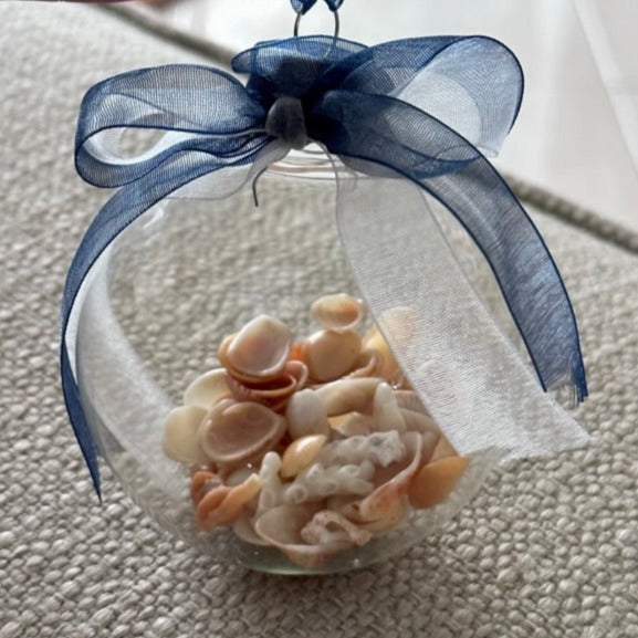 seashell ornament round yellow shells with blue and white ribbon